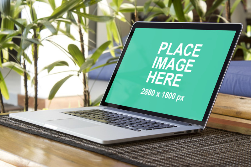 Macbook Pro outside on wooden table