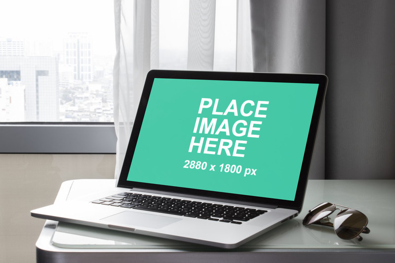 Macbook Pro with city background