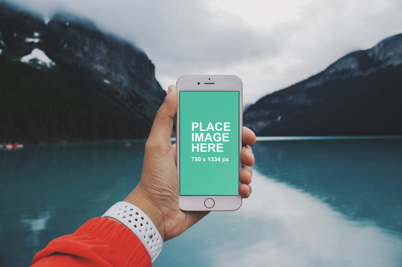 Man holding iPhone outdoors