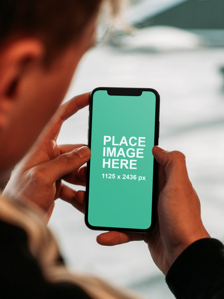 Man holding iPhone X