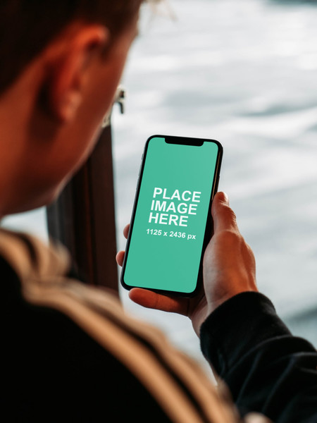 Man holding iPhone X