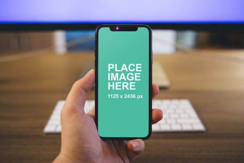 Man holding iPhone X