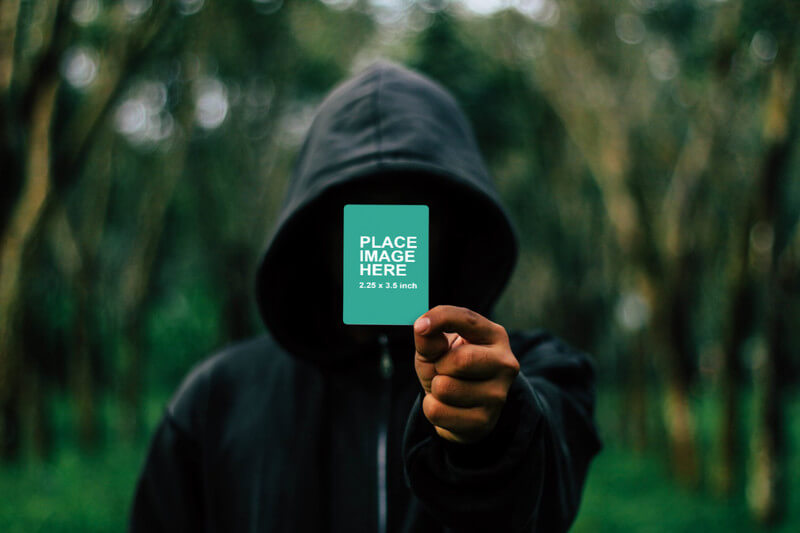 Man holding small card