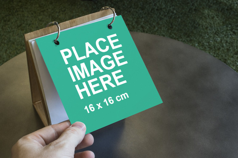 Man holding small paper sheet