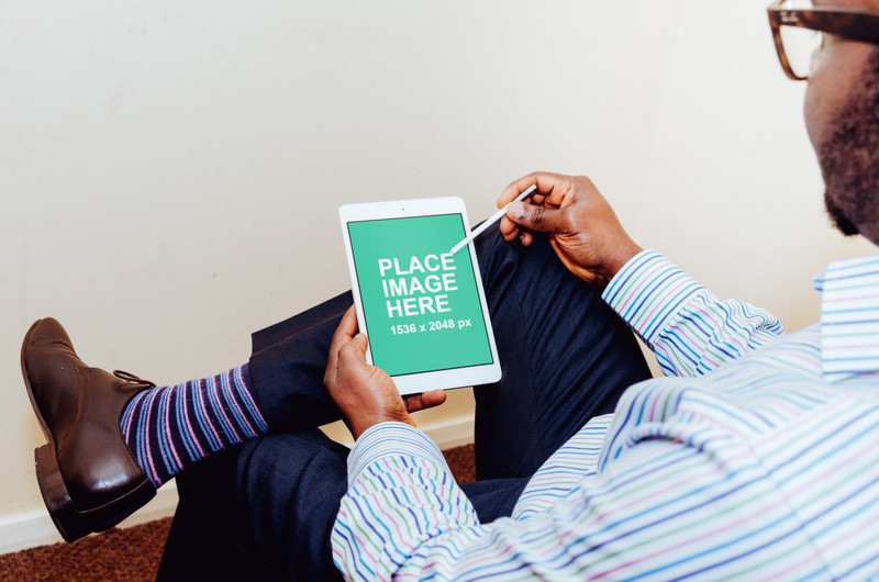 Man working on iPad Mini