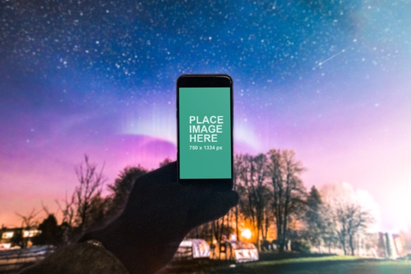 Man holding iPhone outside