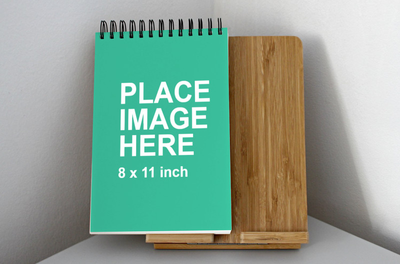 Paper notebook on wooden board