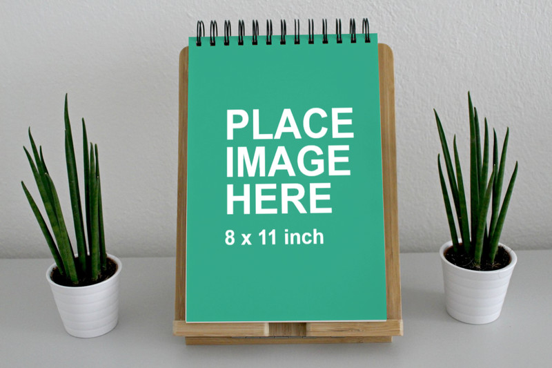 Paper notebook on wooden board