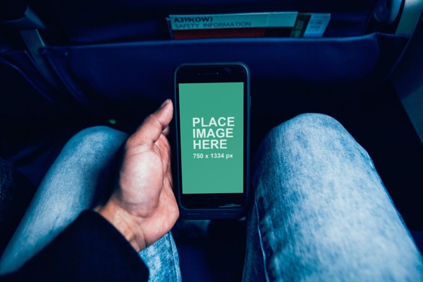 Black iPhone in plane