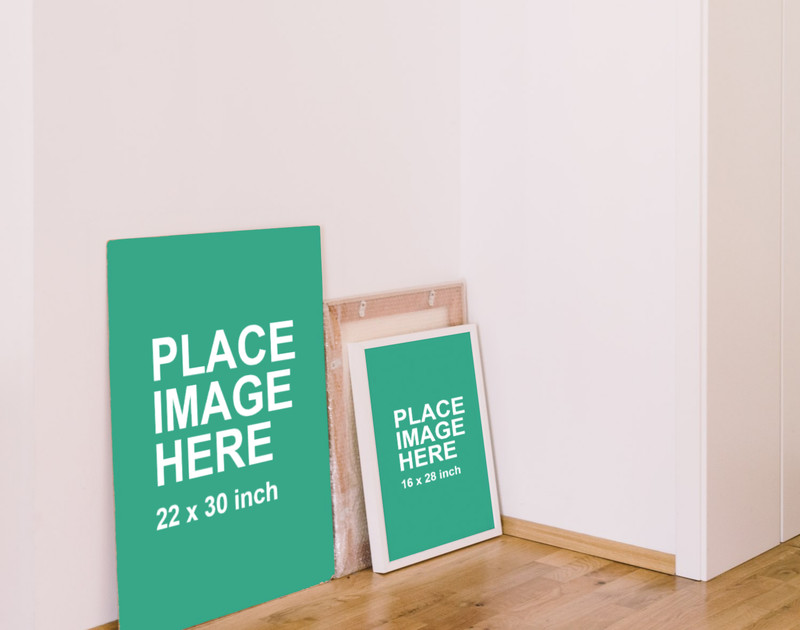 2 posters standing at wall