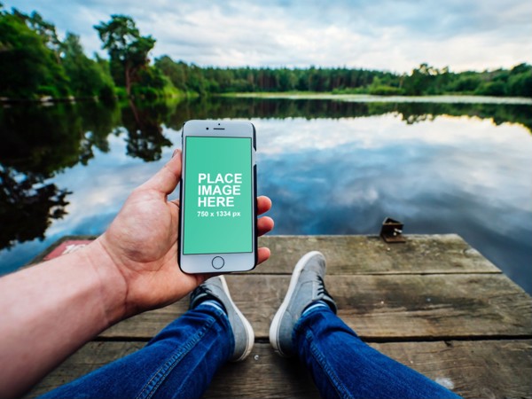 White iPhone outside in nature
