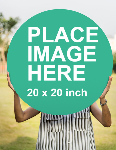 Woman holding large sign