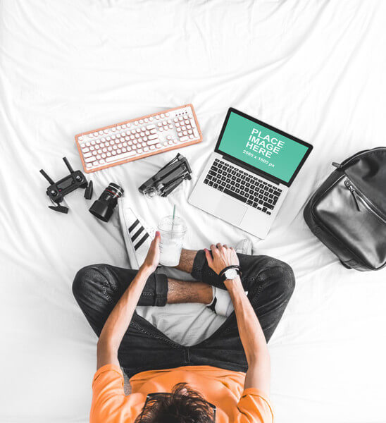 Top down view of man with Macbook Pro