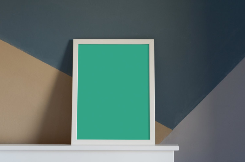 White frame above fireplace