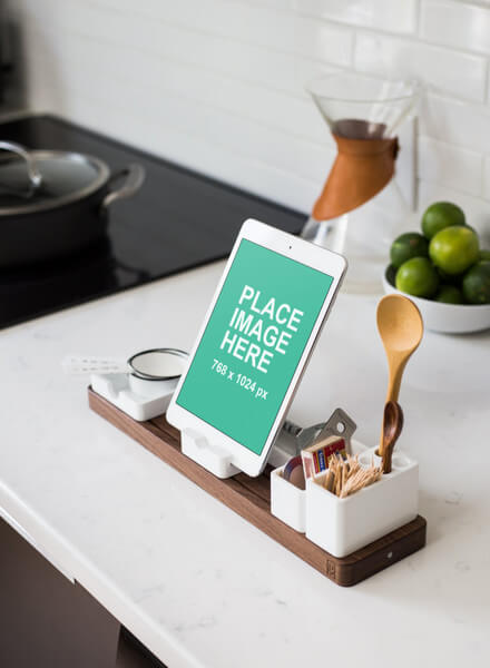 White iPad on kitchen bench