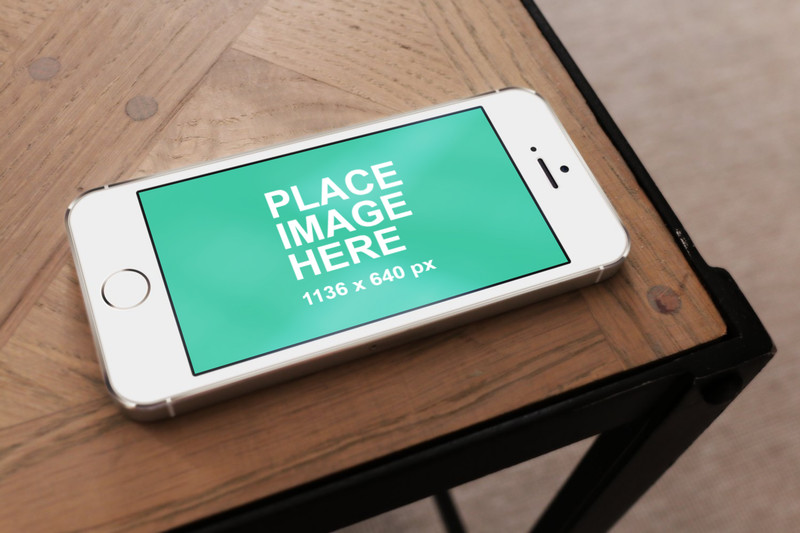 White iPhone 5 on table landscape