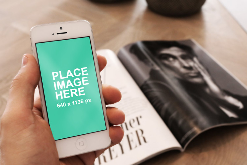 White iPhone 5 with magazine