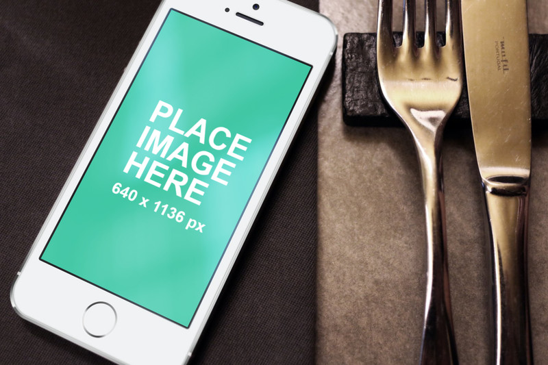 White iPhone 5s with fork