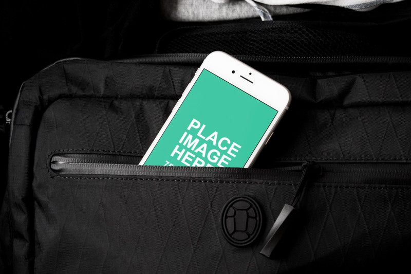 White iPhone 6 in black bag
