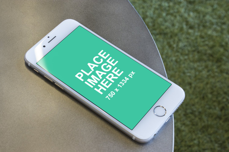 White iPhone 6 on round table