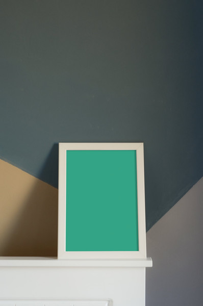 White frame leaning on wall