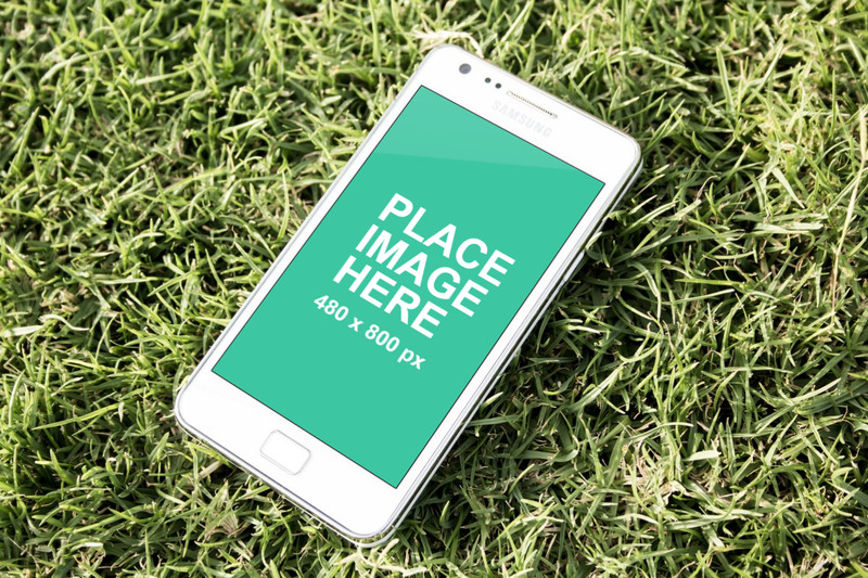 White Samsung Galaxy on grass
