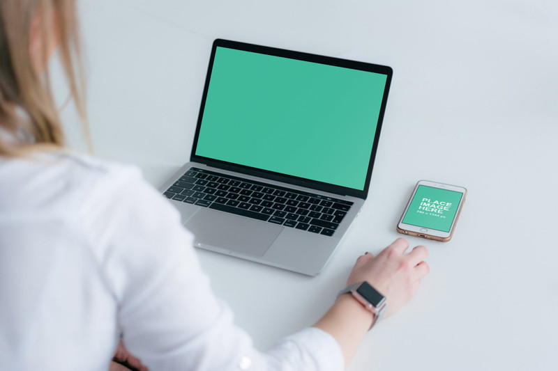 Woman with MacBook Pro and iPhone
