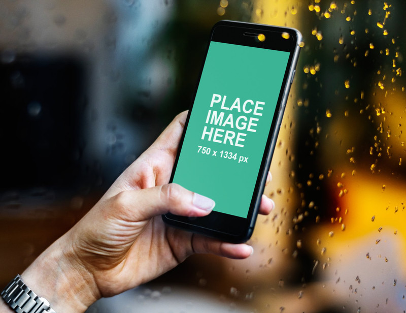 Woman holding black iPhone 8