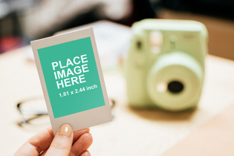 Woman holding Instant photo
