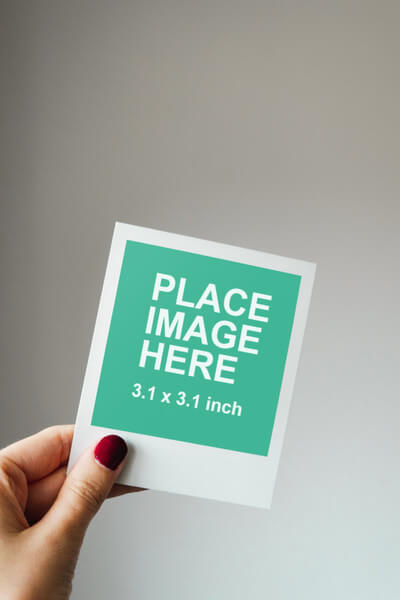 Woman holding instant photo
