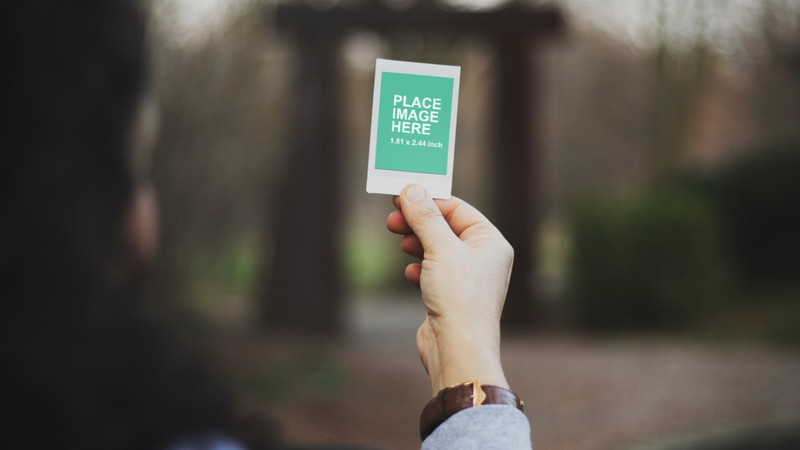 Woman holding instant photo