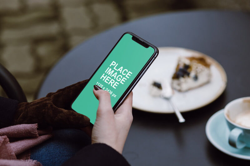 Woman holding iPhone X