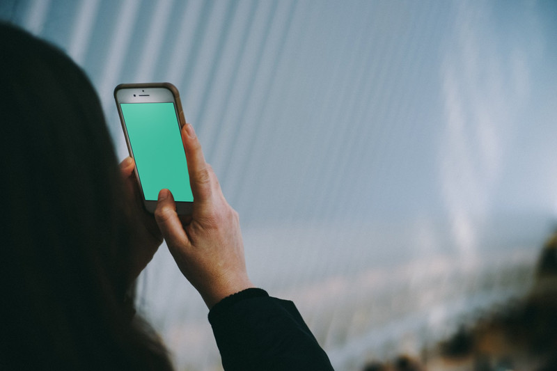 Woman holding iPhone