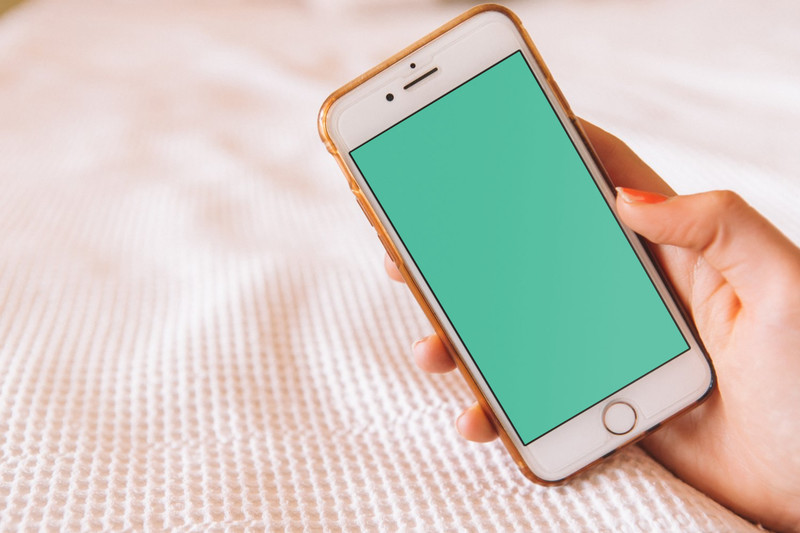 Woman holding iPhone