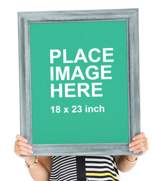 Woman holding large picture frame