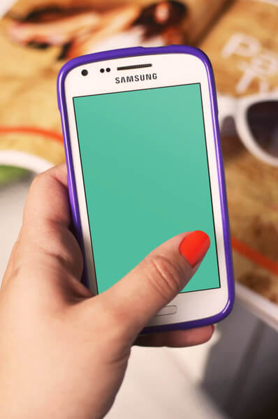 Woman holding Samsung Android