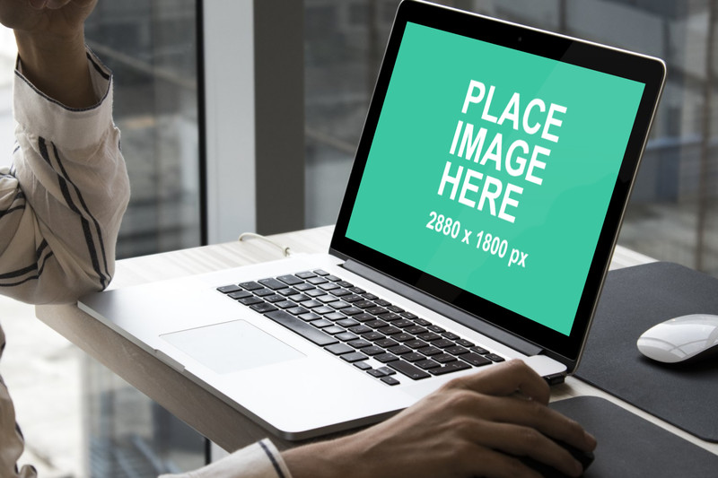 Woman in front of Macbook Pro