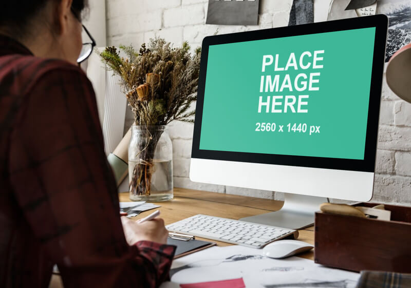 Woman working with iMac