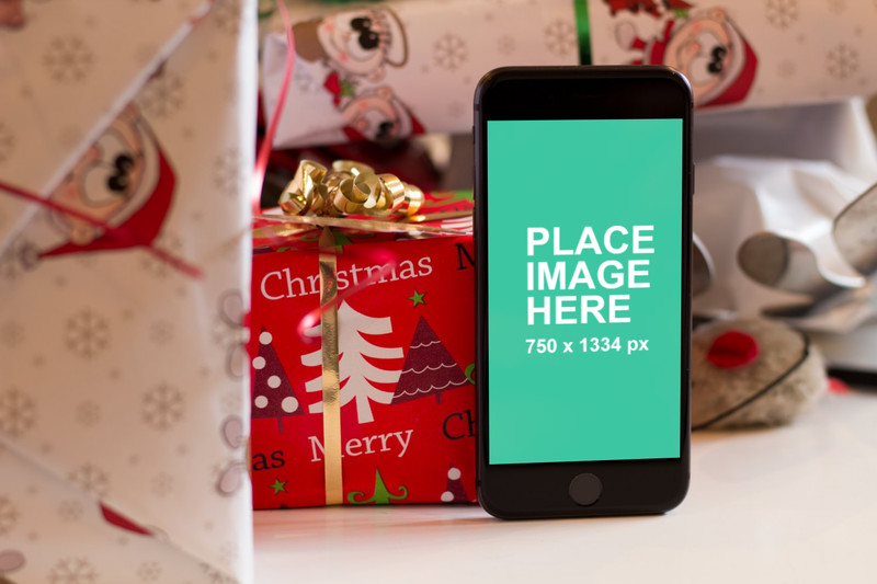iPhone 8 with Christmas presents
